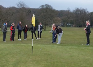 Katie (being helped by Molly!!) nearly holes this putt from off the green!